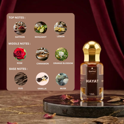 Qafra Hayat perfume oil showing all notes of Hayat attar like Saffron, Bergamot, Lemon, Rose, Cinnamon, Orange blossom, Oud, Vanilla, Musk with premium curtain in backgroud and bottle is on black marble 
