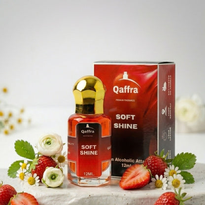 Qaffra Soft Shine 12ml Attar bottle and packaging with strawberries and flowers on a white background